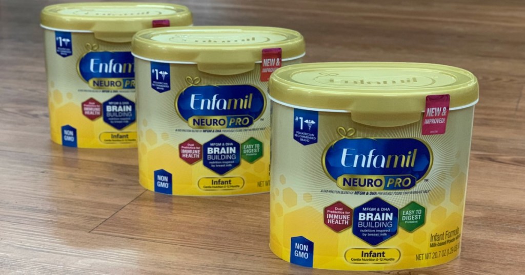 three tubs of infant formula on counter