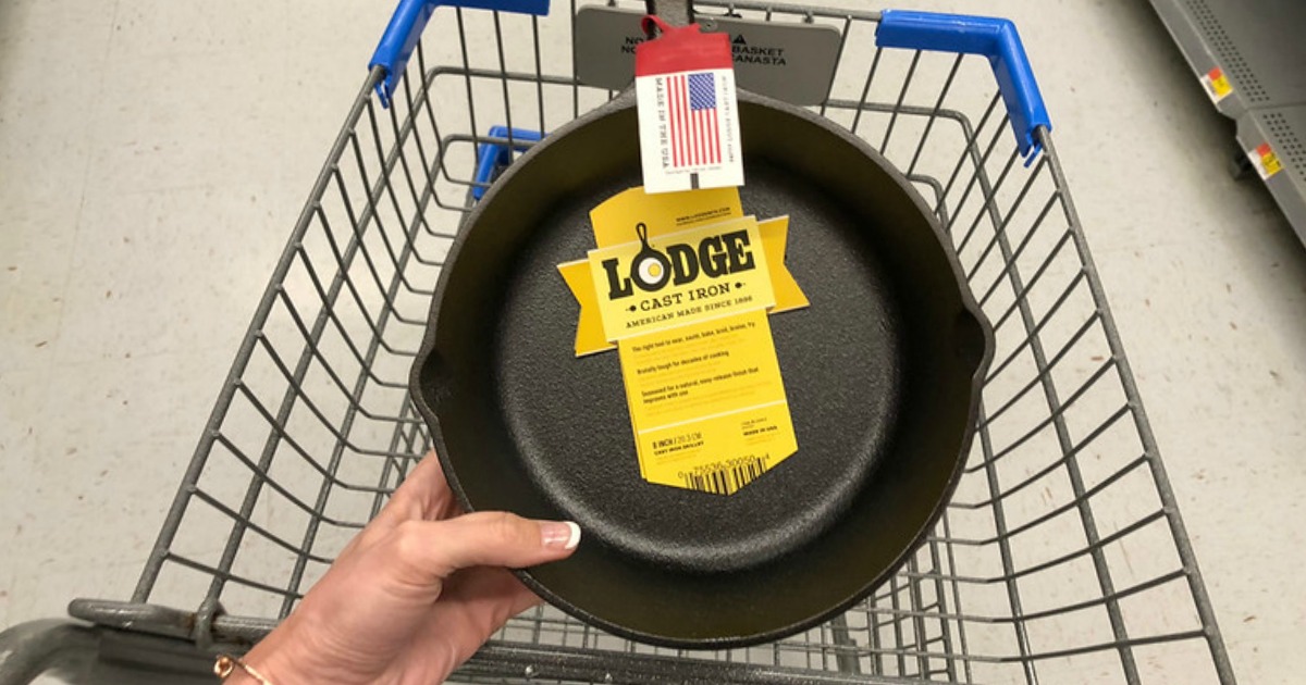 hand holding lodge cast iron skillet over walmart basket