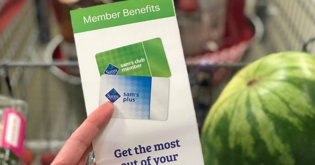 hand holding up sam's club membership benefits pamphlet 