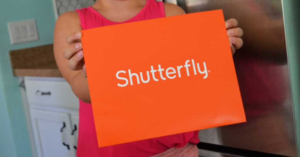 Woman holding large Shutterfly envelope