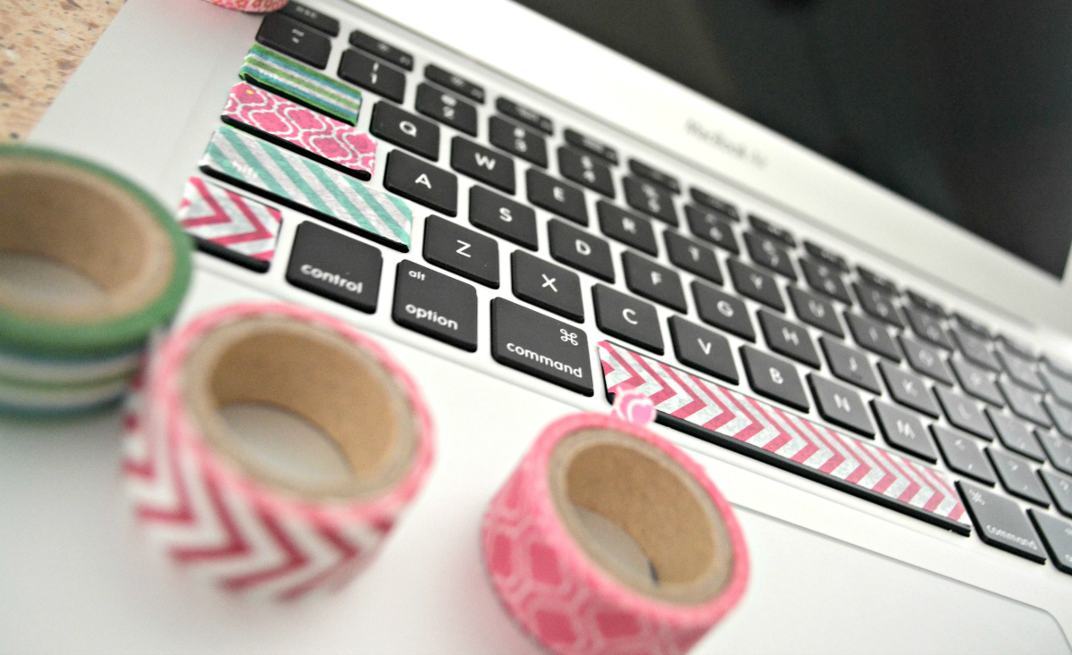 Washi tape embellishments on a laptop keyboard