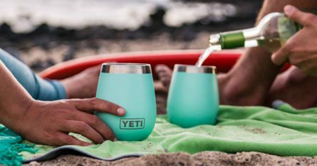 people holding YETI wine tumblers