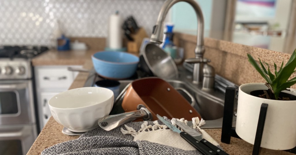 Dishes piled in sink