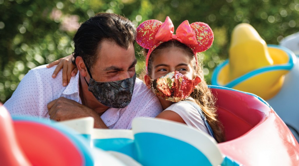 father and daughter on Dumbo ride at disney