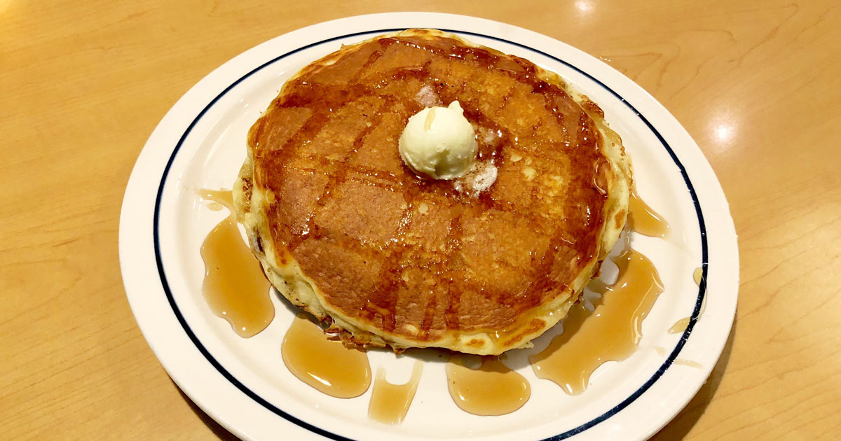 all you can eat ihop deal – buttermilk pancakes on a plate with butter closeup