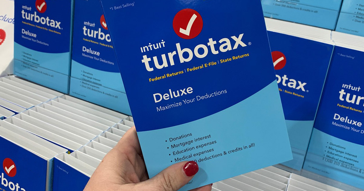 hand holding turbotax deluxe 