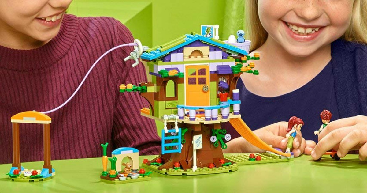 kids playing with LEGO tree house building set