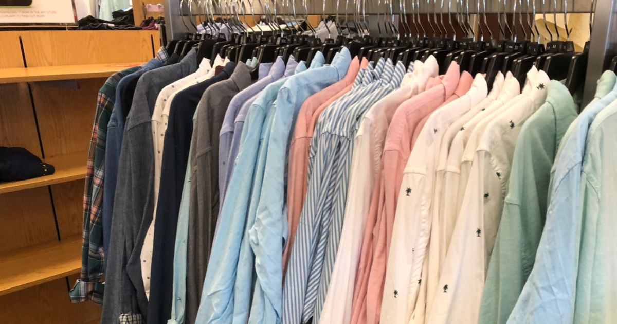 Men's dress shirts hanging on rack