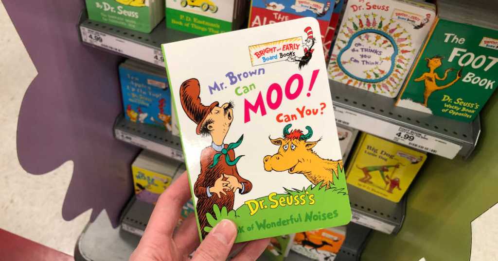 hand holding mr. brown can moo can you board book