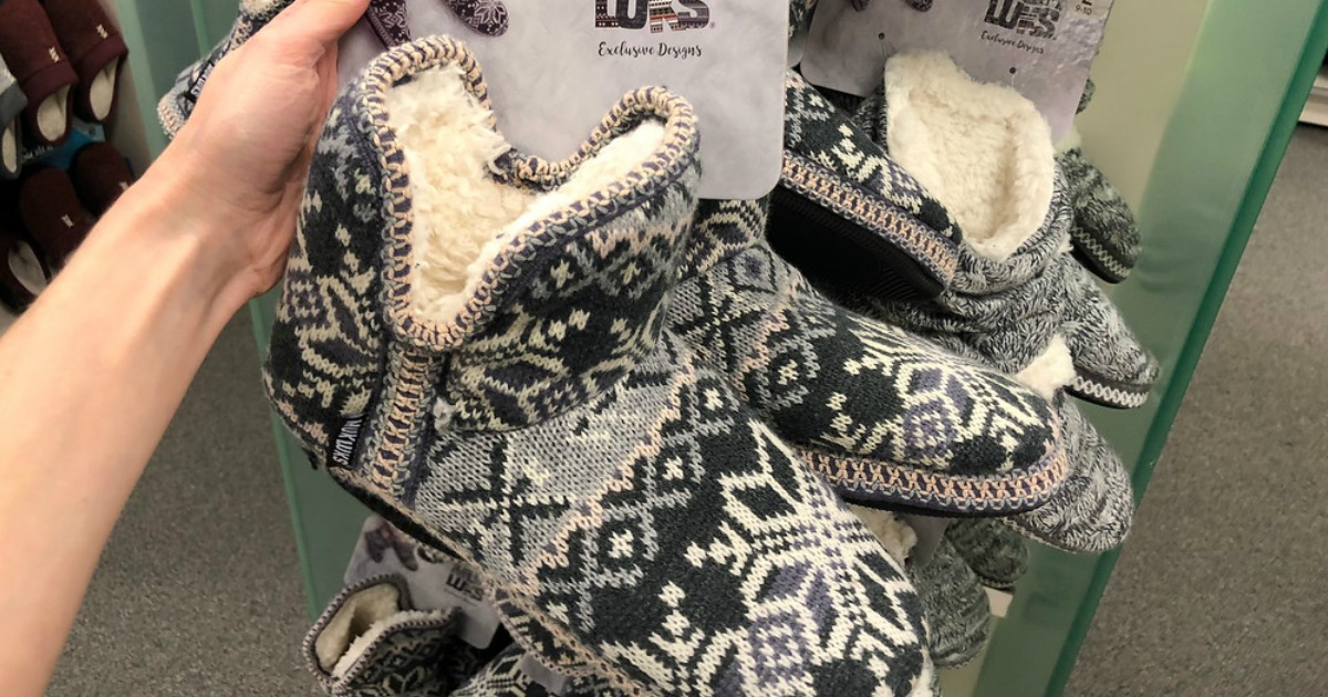 hand holding Muk Luks Boots