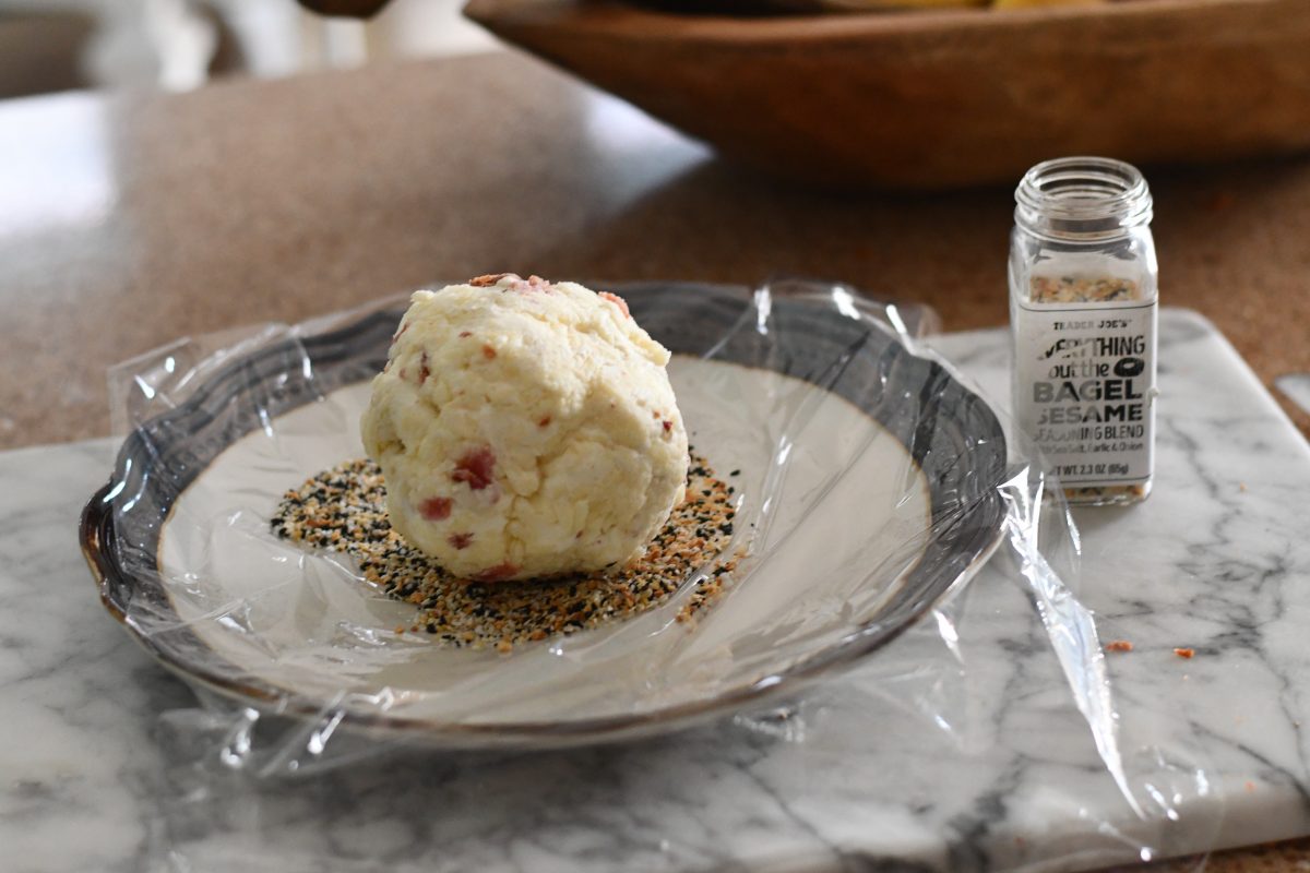 making an everything but the bagel cheese ball using plastic wrap 