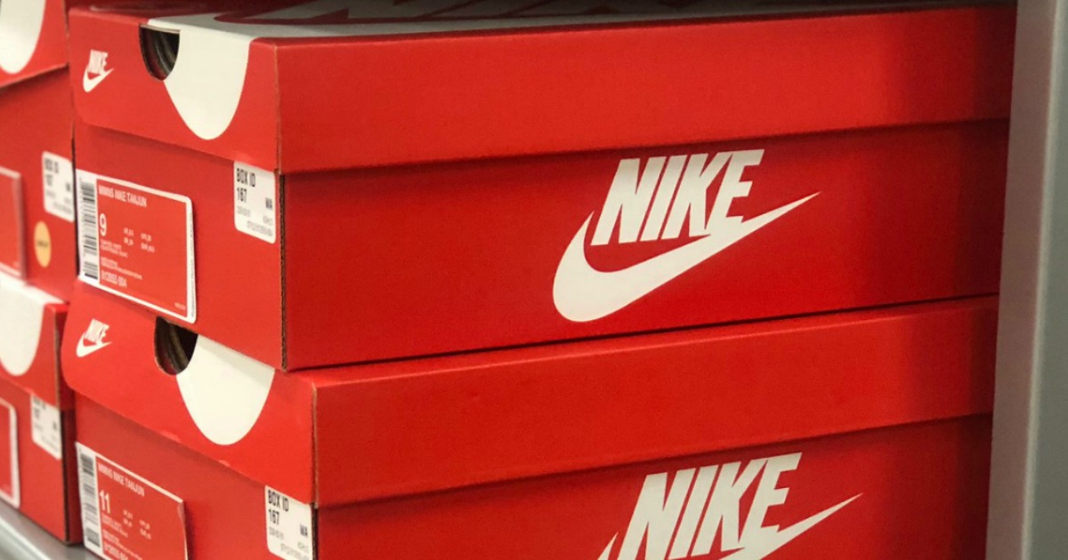 Orange Nike boxes stacked on shelf