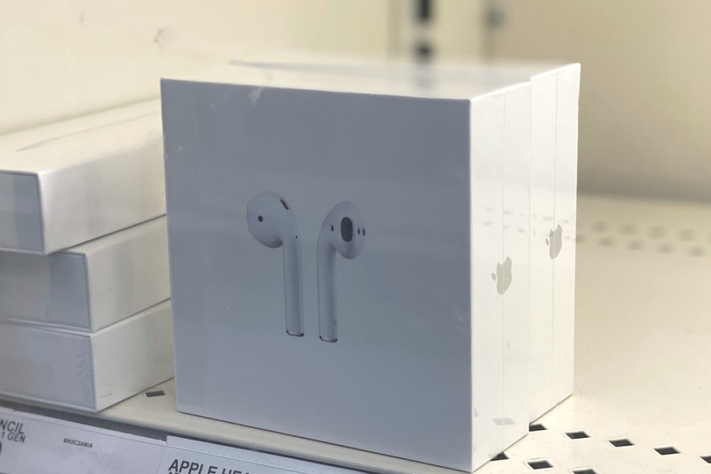 white airpod box on shelf 