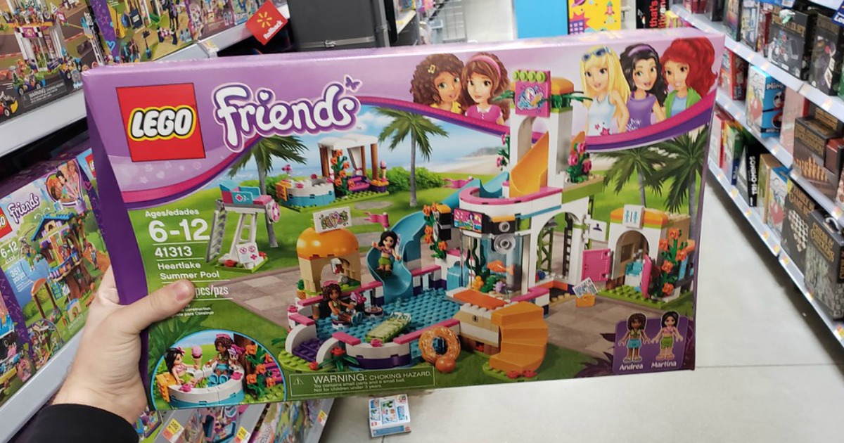 hand holding LEGO Friends Heartlake Summer Pool Set