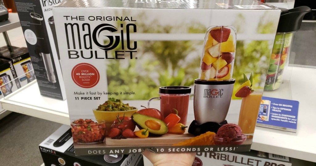 hand holding the Magic Bullet 11 piece box