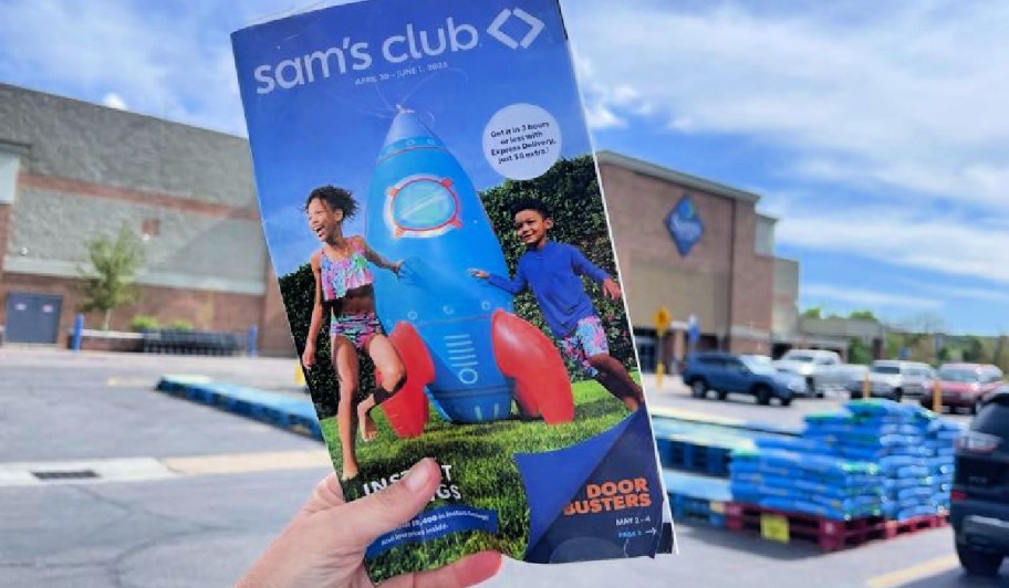 hand holding a sams club doorbusters booklet