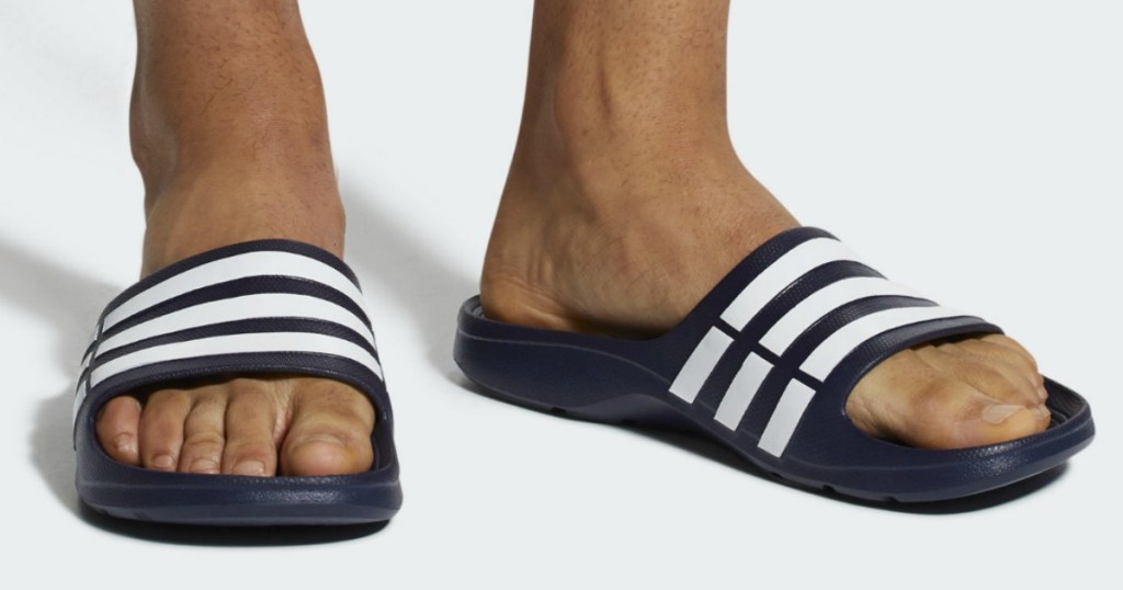 adidas sandals being worn by male