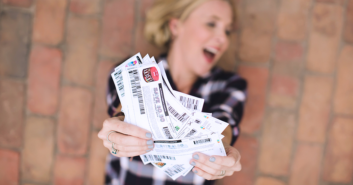 collin holding up a stack of coupons