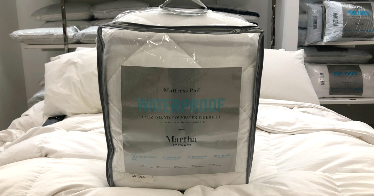 Martha Stewart mattress pad on a bed in-store