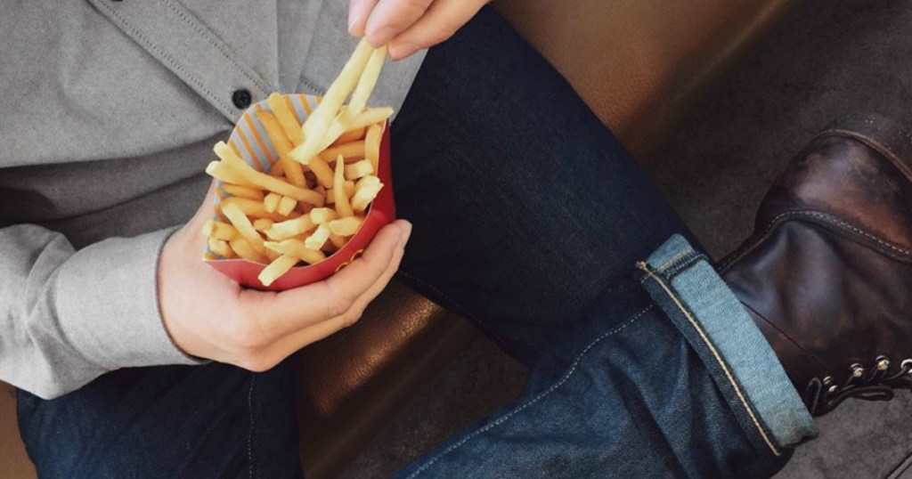 Person holding mcdonalds fries