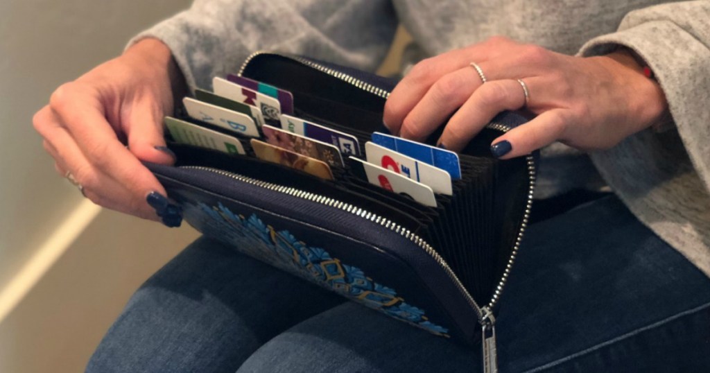 Collin holding wallet with credit cards