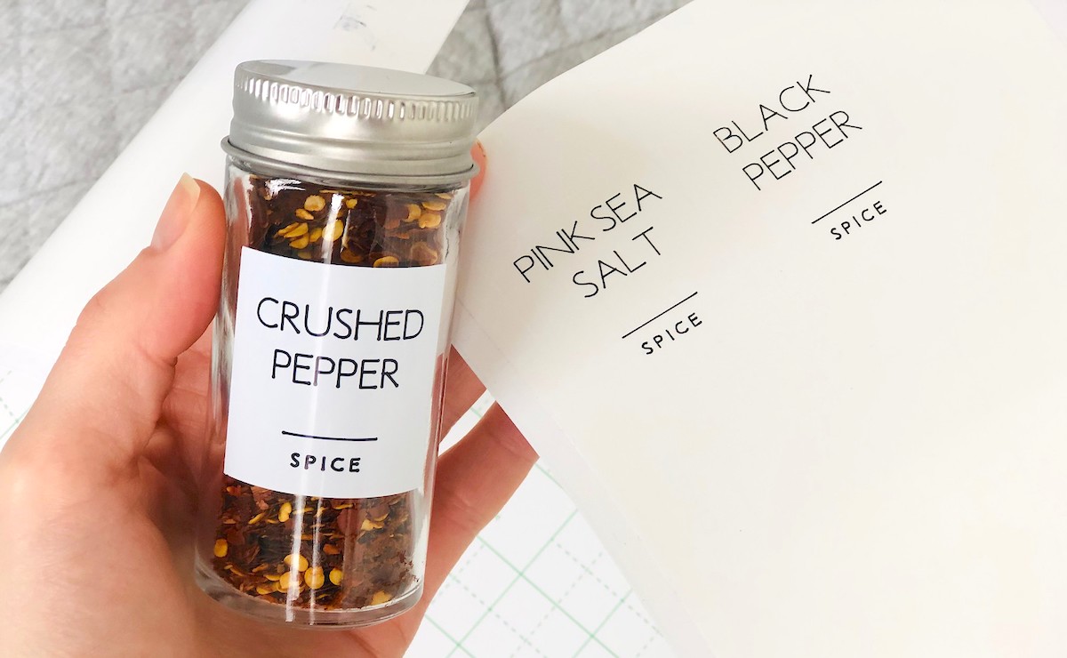 hand holding spices with labels