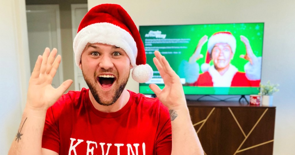 man in Kevin shirt wearing hat and excited 