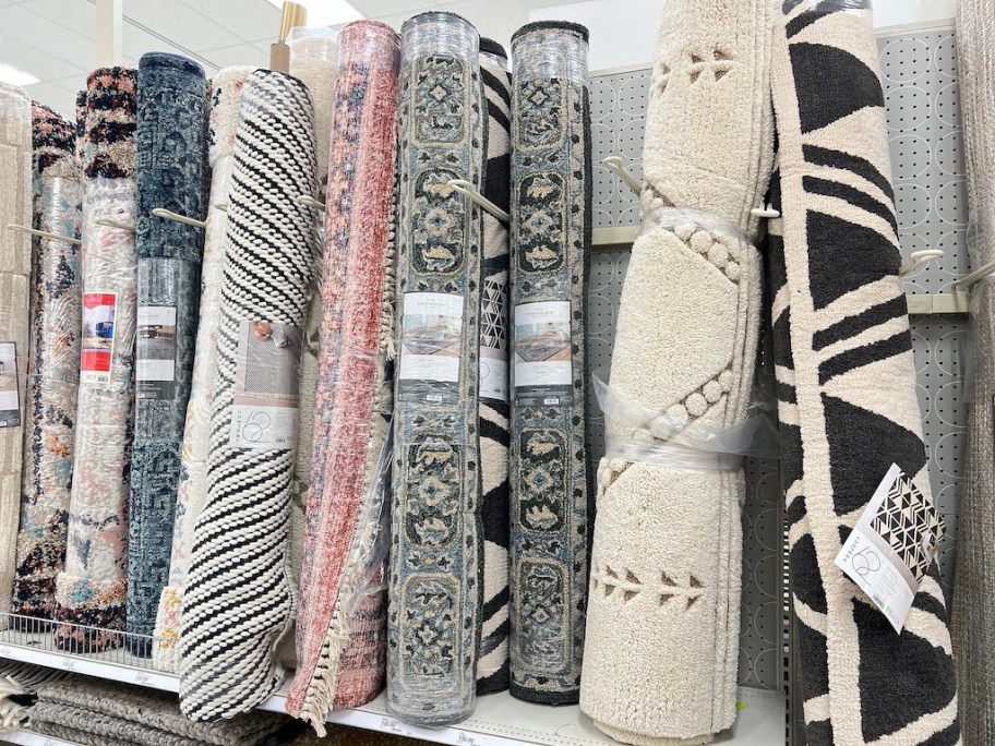 rugs on shelf at store