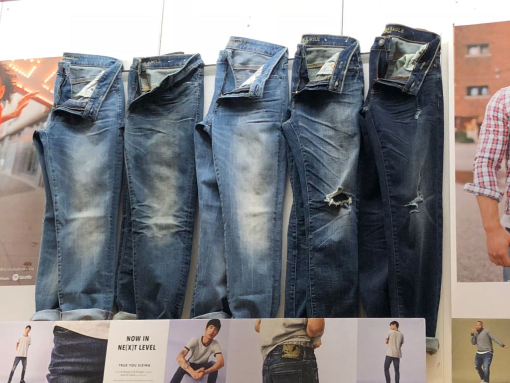 jeans hanging up on display in store