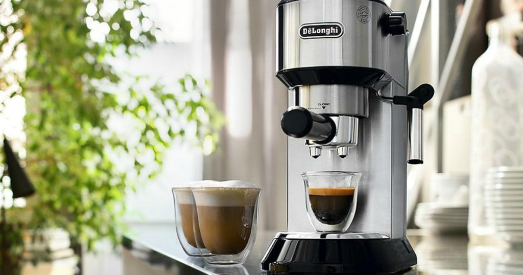 DēLonghi Dedica Espresso and Cappuccino Machine on counter with three glasses