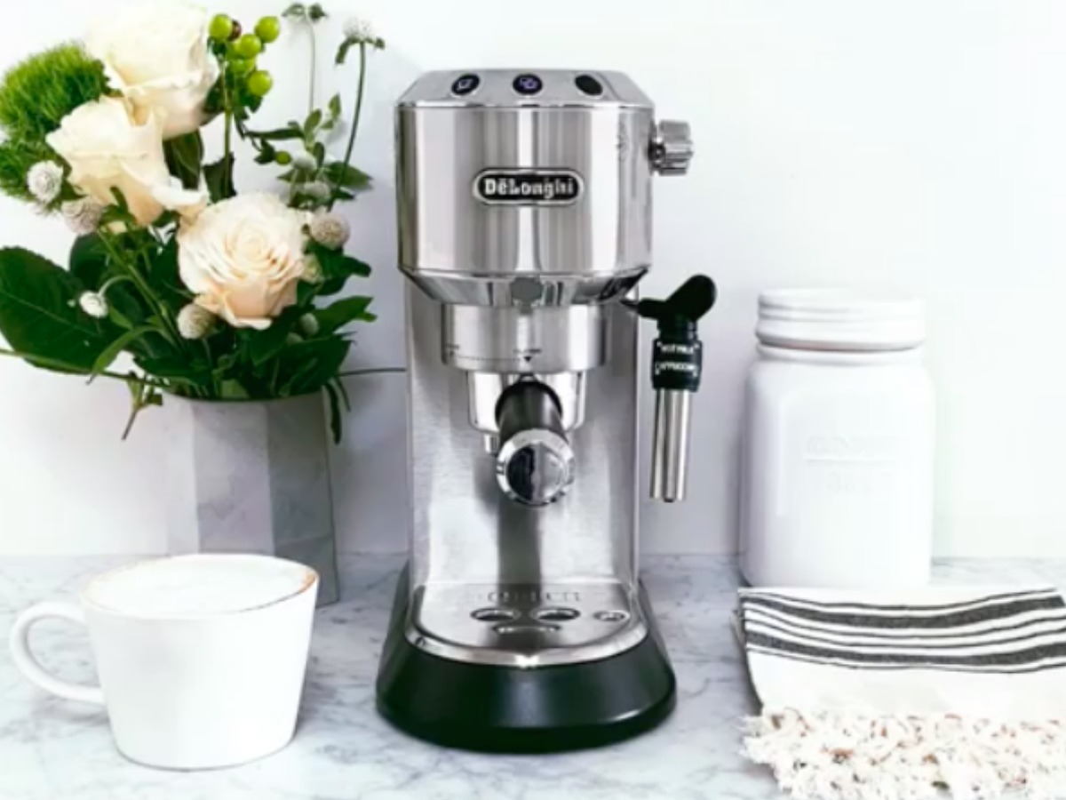 DēLonghi Dedica Espresso and Cappuccino Machine on counter with roses and more