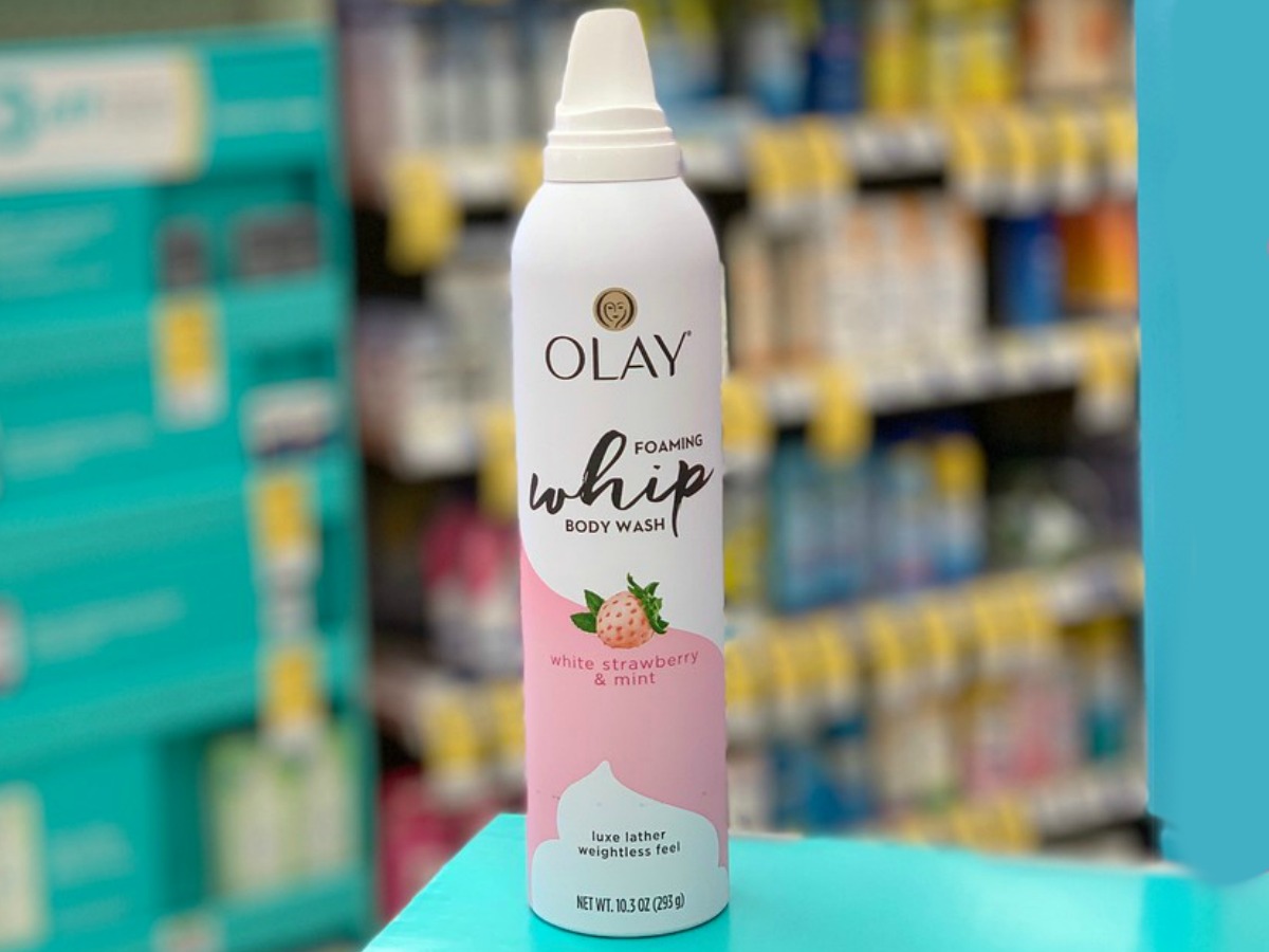 Olay Cooling Foaming Whip Body Wash White Strawberry and Mint on counter at Walgreens