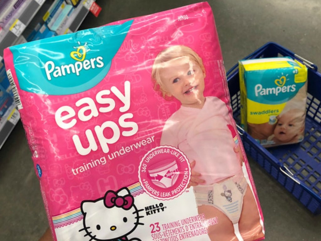 Pampers Easy Ups with Pampers Swaddlers diapers in background