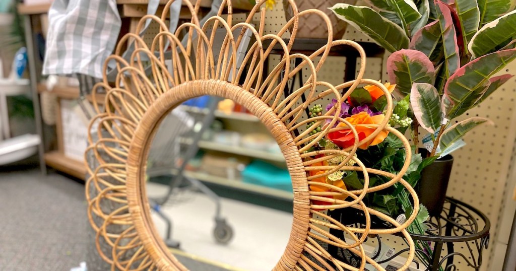 close up of woven rattan mirror on store floor