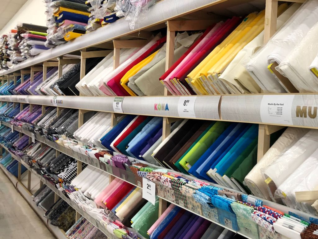 row of fabric bolts at Joann's