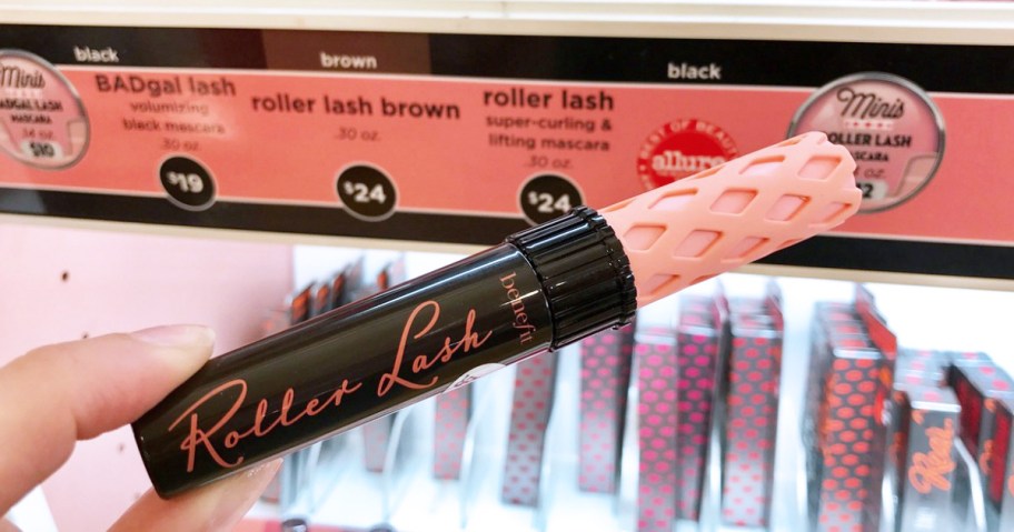 hand holding a benefit roller lash mascara