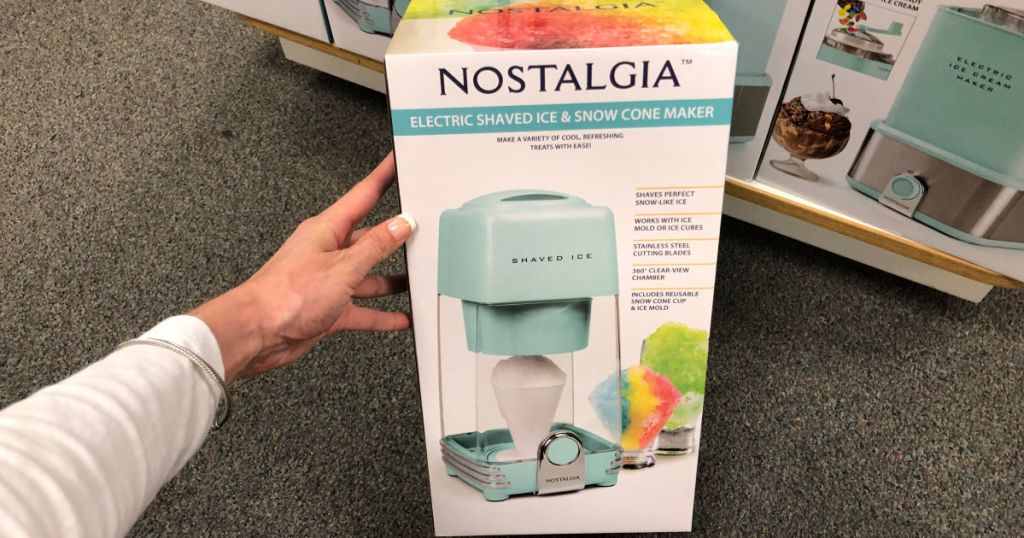 hand holding up nostalgia shave ice maker