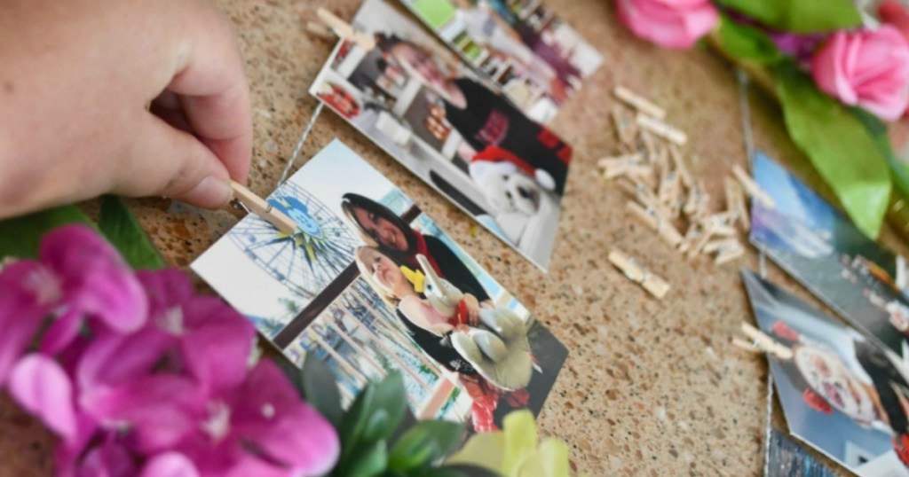 hand pinning up a photo on clothespin