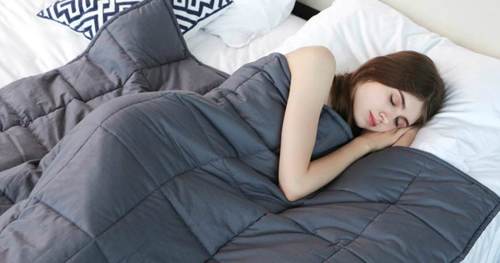 woman sleeping with weighted blanket