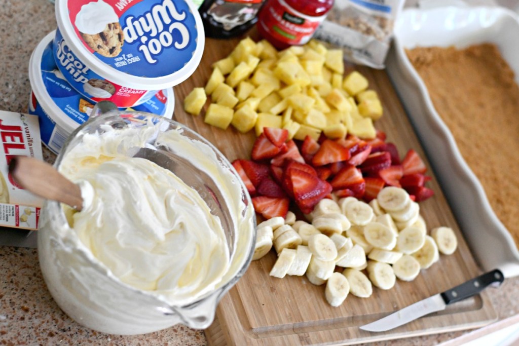 slicing fruit to make banana split dessert 