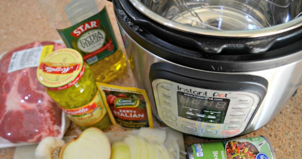 instant pot with ingredients surrounding it on table