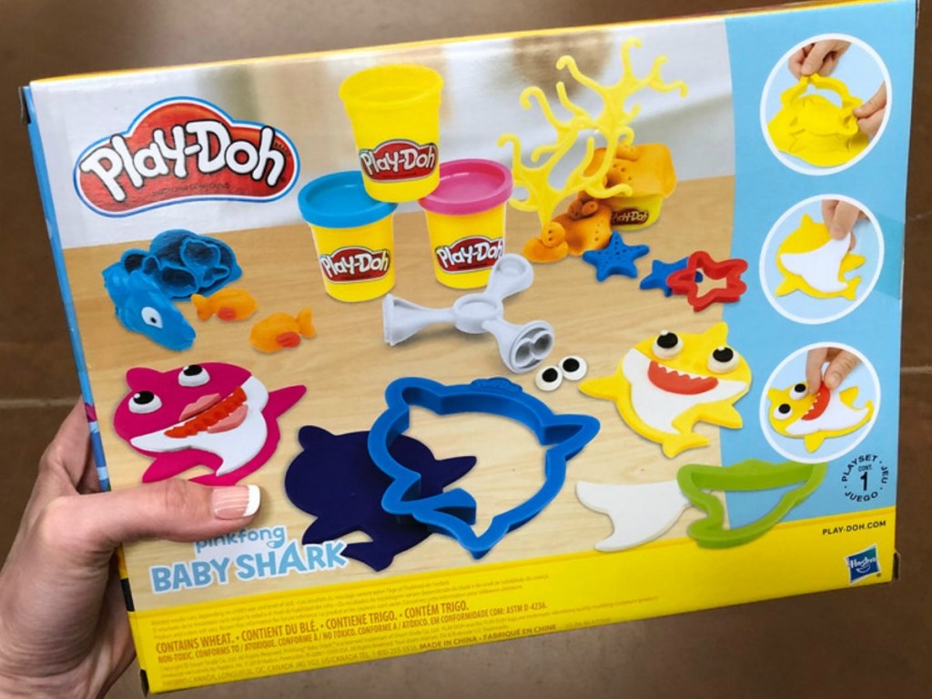 hand holding playdoh set in box