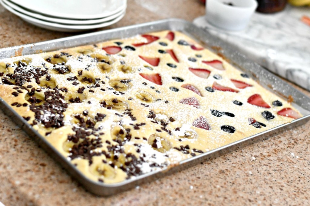 sheet pan pancakes with dusting of powdered sugar