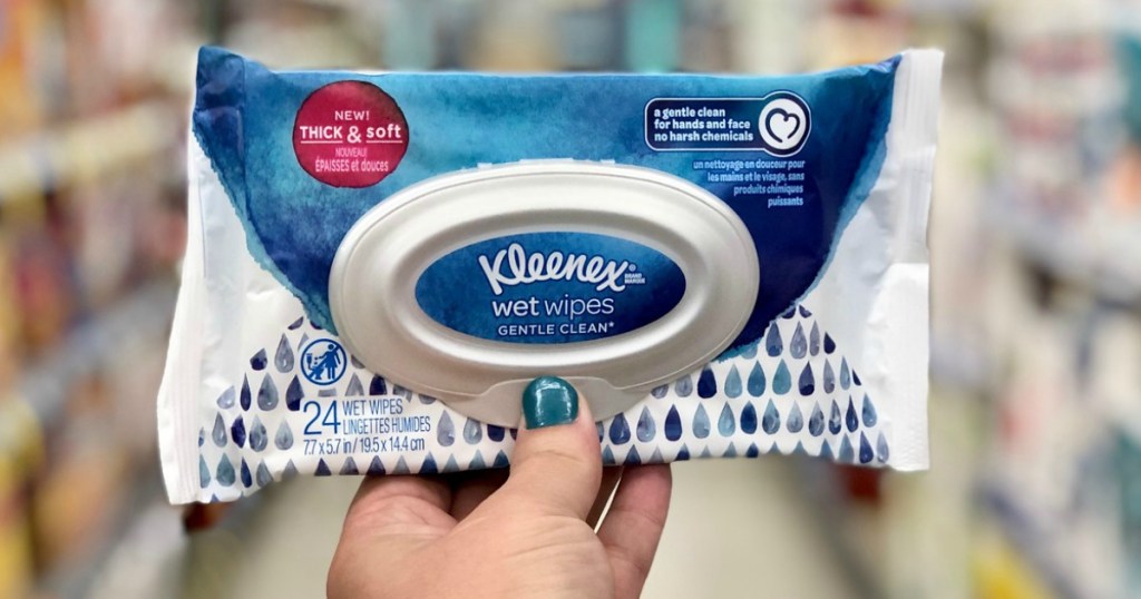 hand holding kleenex wet wipes at walgreens