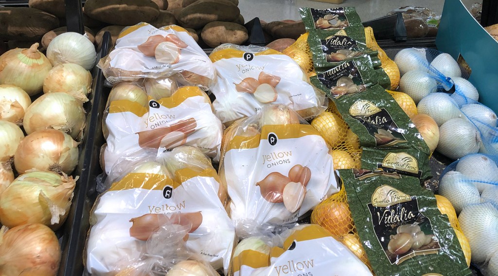 selection of yellow and vidalia onions at publix