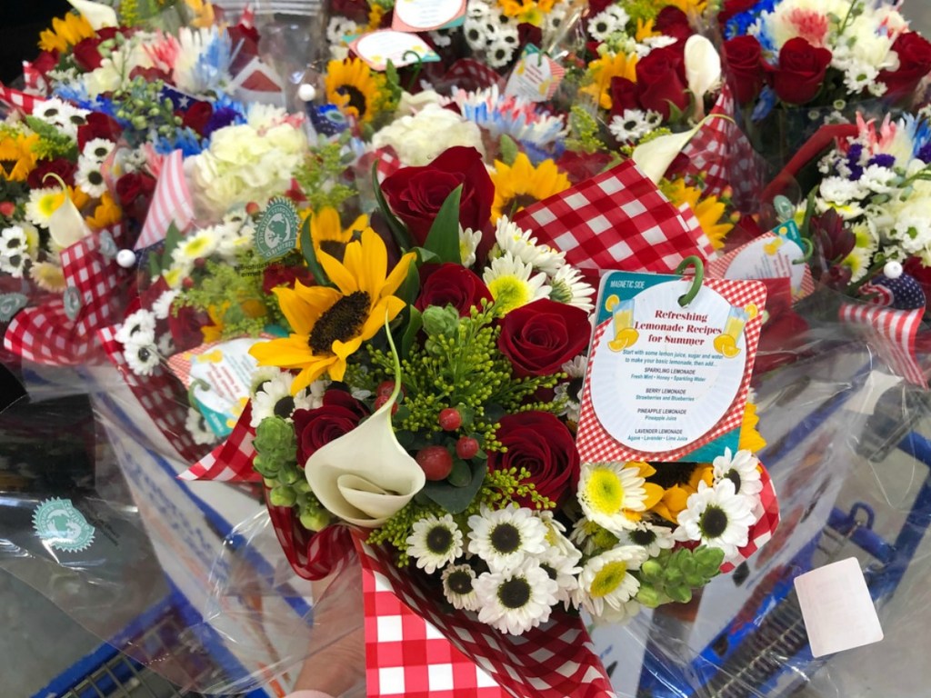 hand holding bouquet of fresh flowers