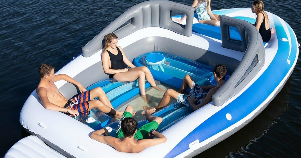 people lounging in a huge inflatable party boat