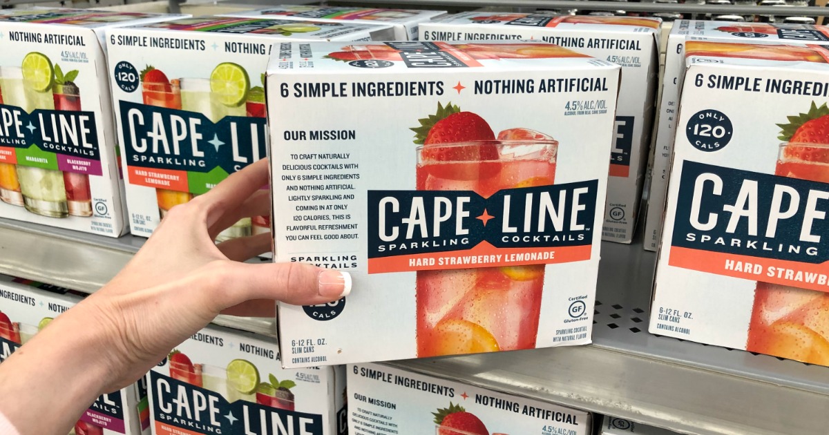 Woman holding Cape Line Strawberry Lemonade Sparking Cocktails in Walmart store