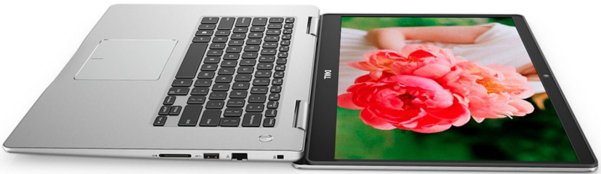 Dell laptop open with picture of woman holding pink flower on the screen