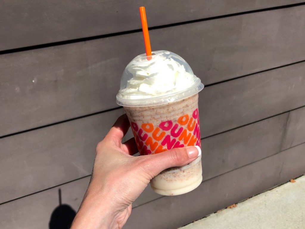 lady holding a Dunkin Donuts candy inspired coffee beverage